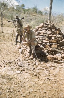 Surveying with 'kituti' markers. District Forest Officer James Lang Brown (right) is accompanied by