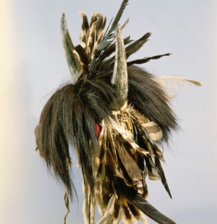 Among the Blackfoot a high position in warrior society might be marked by the wearing of a war cap surmounted by buffalo horns
