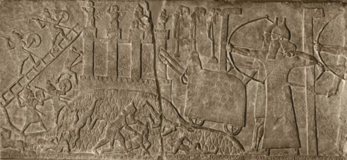 Stone relief from the Palace of Tiglath   Pileser attacking a city with a battering ram