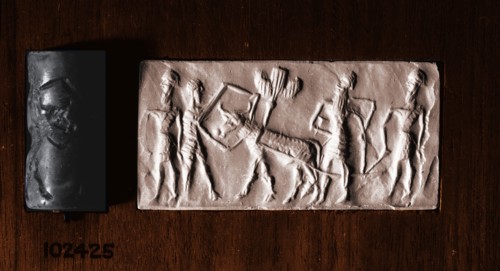 Cylinder seal of a man holding an ox which pulls a seed plough guided by two further bearded figures