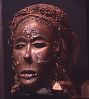 Dance mask of a type known as Mwana Pwo, regarded as an idealised depiction of a beautiful young girl, showing facial scarifications