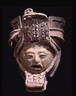 Pottery figurine with elaborate headdress