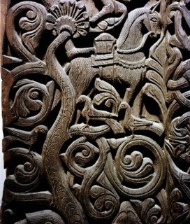 Detail of a carving from a stave church portal illustrating the story of Sigurd