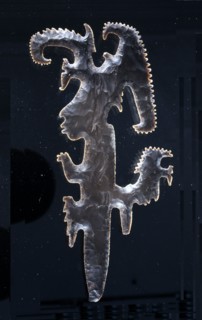Eccentric axe with representation of a lord