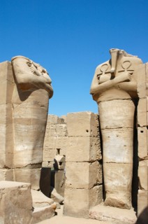 Two headless statues of a pharaoh