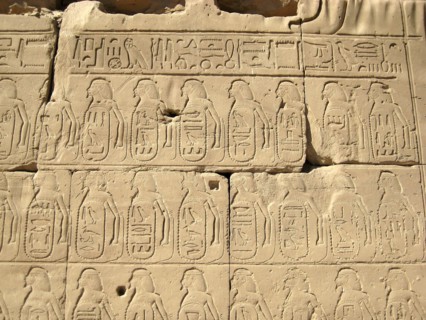 Relief of hieroglyphic insription and captive in the Cachette Court