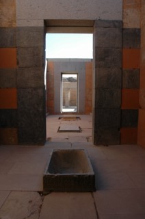 Interior view of the Red Chapel of Hatshepsut showing a granite lustral basin