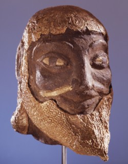 Etruscan head overlaid with gold