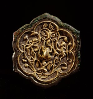 The reverse side of a small bronze lotus shaped mirror