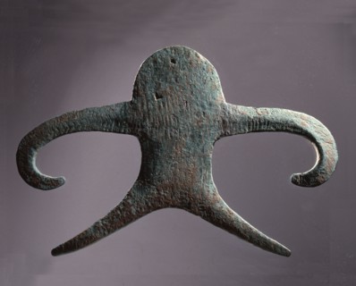 Anthropomorpic figure from a copper hoard probably a symbol of female creativity used as a cult object