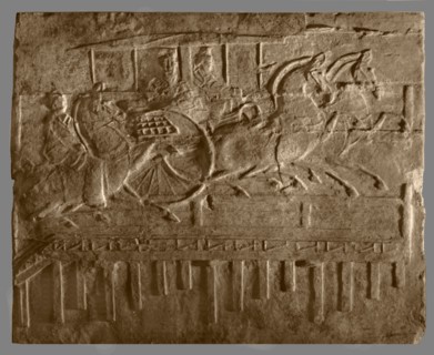 Brick from a tomb structure impressed with horses and carriage crossing a bridge