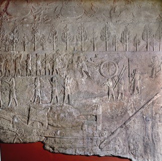 Detail of a relief depicting gangs of slaves hauling and levering a colossal stone bull mounted on a sledge during the building of Sennacheribs palace at Nineveh
