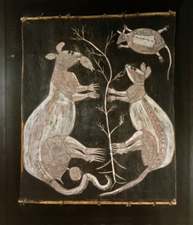 Bark painting in X ray style depicting a pair of kangaroos