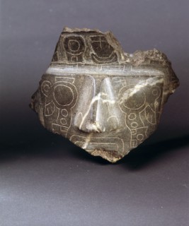 Fragment of a carved stone face with a weeping eye incised design similar to the so called Weeping God on the Gateway of the Sun at the ceremonial centre of Tiahuanaco