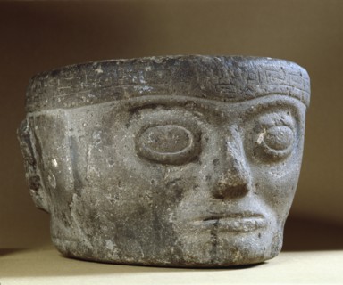 Stone head with turban like headdress