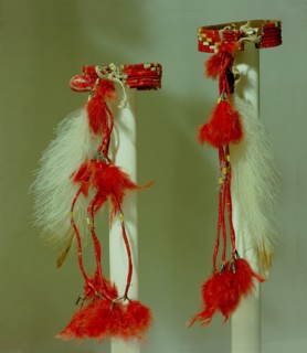 Armbands like these, decorated with porcupine quillwork and feathers, would have been worn on the upper arm by a Sioux dancer as part of a set of dance costume accessories