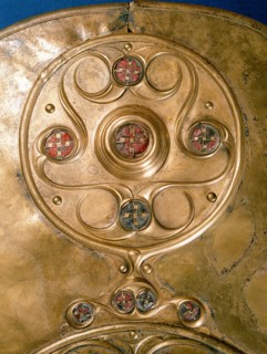 Bronze shield decorated with studs in red glass paste