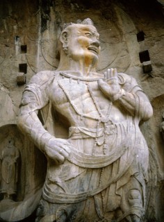 One of the guardian kings of Buddhism carved on the north wall of the Fengxian temple at theLongmen cave temple complex