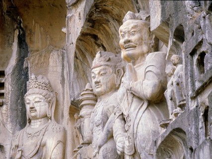 The Guardian kings of Buddhism carved on the north wall of the Fengxian temple at the Longmen cave temple complex