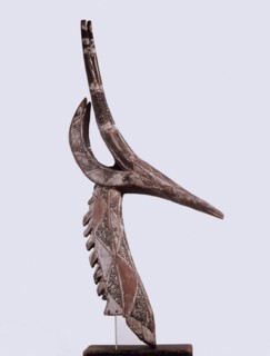 Although in the form of a gazelle these mask headdresses actually depict and are called by the name of a specific dead elder