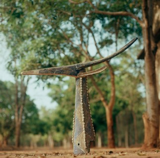 Although in the form of a gazelle these mask headdresses actually depict and are called by the name of a specific dead elder