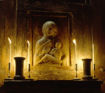 Marble relief of the Virgin Hodegetria in San Marco, Venice, lit by candlelight