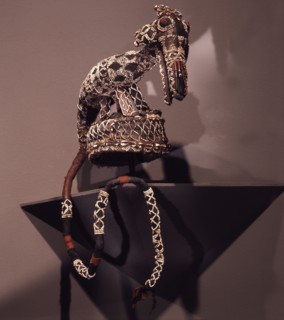 The headdress of a mask costume representing a leopard, a crucial symbol of kingship in the dance societies of the Bamileke