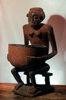 A seated female bowl figure, probably a royal prestige object