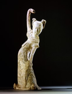 Unglazed pottery figure of a dancing woman