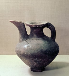 Unglazed jug that resembles in form an oinochoe