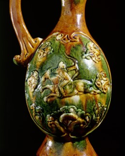 Detail of a ewer decorated in relief with a galloping horseman bearing a bow