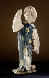 Blue glazed figure of a court lady with one arm raised