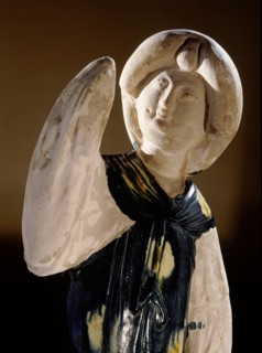 Blue glazed figure of a court lady with one arm raised