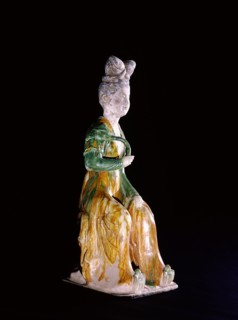 Figure of a seated court lady holding a lotus stem