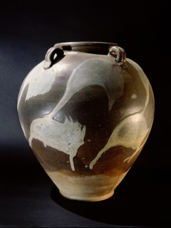 Brown and cream glazed vessel