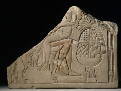 Lower half stela of couple on chair, woman on lap of man offering table to the right