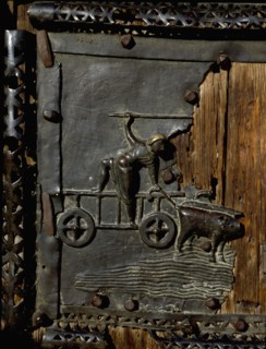 Detail of the bronze door of the Basilica of San Zeno which is decorated with 48 panels illustrating biblical stories and the lives of St Peter, St Paul, St Zeno, St Helena among others, and items con...