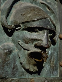 Detail of the bronze door of the Basilica of San Zeno which is decorated with 48 panels illustrating biblical stories and the lives of St Peter, St Paul, St Zeno, St Helena among others, and items con...