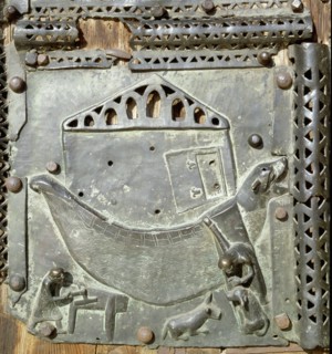 Detail of the bronze door of the Basilica of San Zeno which is decorated with 48 panels illustrating biblical stories and the lives of St Peter, St Paul, St Zeno, St Helena among others, and items con...