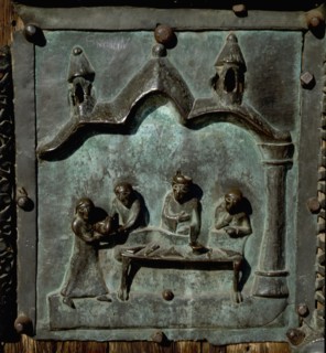 Detail of the bronze door of the Basilica of San Zeno which is decorated with 48 panels illustrating biblical stories and the lives of St Peter, St Paul, St Zeno, St Helena among others, and items con...