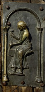 Detail of the bronze door of the Basilica of San Zeno which is decorated with 48 panels illustrating biblical stories and the lives of St Peter, St Paul, St Zeno, St Helena among others, and items con...