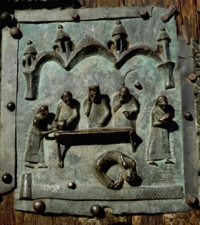 Detail of the bronze door of the Basilica of San Zeno which is decorated with 48 panels illustrating biblical stories and the lives of St Peter, St Paul, St Zeno, St Helena among others, and items con...