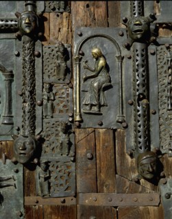 Detail of the bronze door of the Basilica of San Zeno which is decorated with 48 panels illustrating biblical stories and the lives of St Peter, St Paul, St Zeno, St Helena among others, and items con...