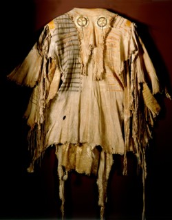 A deerskin war shirt which belonged orignially to a Blood (a Blackfoot sub tribe) chief named Katookinay (No Top Knot)