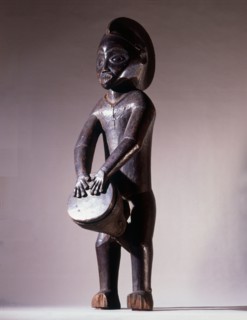 Among the Mbala, wooden sculptures of drummers were kept in the chiefs house as a symbol of his authority
