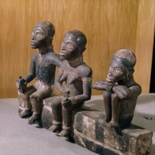 A Kongo or Yombe carving depicting a bridegroom in European clothes, together with his bride and a relative