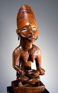 Mother and child carving (phemba) honouring female reproductive power, an idealised image of womens role, and by implication of the growth and wealth of the kingdom