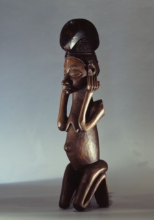 Yaka sculpture of a kneeling woman