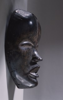 Mask of a type called Deangle, which collects food from village women and brings it to boys secluded in the bush circumcision camp