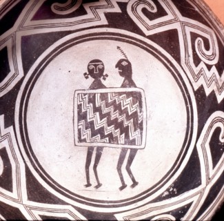 Pottery bowl with schematic human figures and black on white geometric design